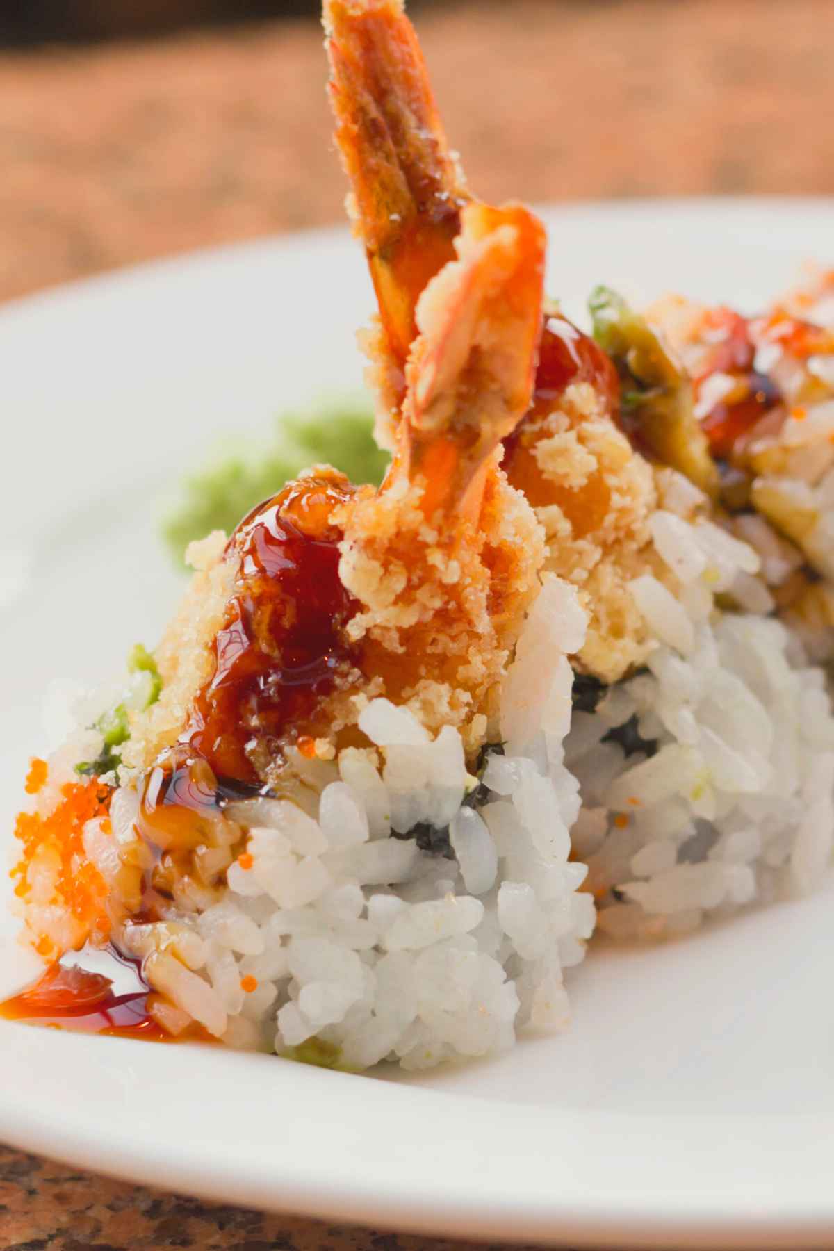 Get ready for an explosion of flavors with this easy-to-make sushi roll! A Dynamite Roll features crispy tempura shrimp, avocado, cucumber, mango and a delicious sauce that simply tantalizes your taste buds. A beautiful combination of sweet and savory flavors, we highly recommend serving this roll as a dinner party appetizer. However, we also understand if you decide to keep this delicious secret to yourself.