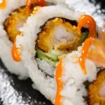 Get ready for an explosion of flavors with this easy-to-make sushi roll! A Dynamite Roll features crispy tempura shrimp, avocado, cucumber, mango and a delicious sauce that simply tantalizes your taste buds. A beautiful combination of sweet and savory flavors, we highly recommend serving this roll as a dinner party appetizer. However, we also understand if you decide to keep this delicious secret to yourself.