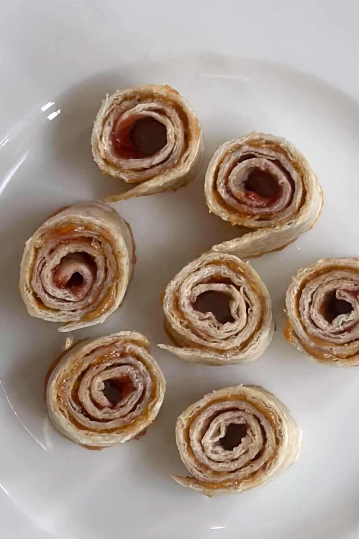 Flour Tortilla and Jelly pinwheels are loaded with sweet jam and smooth peanut butter, and wrapped in flour tortillas. It’s a super easy snack to make. Tuck them into lunch boxes or have them ready to enjoy as a quick snack when the kids come home from school.