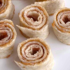 Flour Tortilla and Jelly pinwheels are loaded with sweet jam and smooth peanut butter, and wrapped in flour tortillas. It’s a super easy snack to make. Tuck them into lunch boxes or have them ready to enjoy as a quick snack when the kids come home from school.