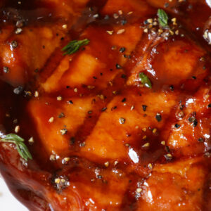 Pork chop grilled to perfection and served on a plate