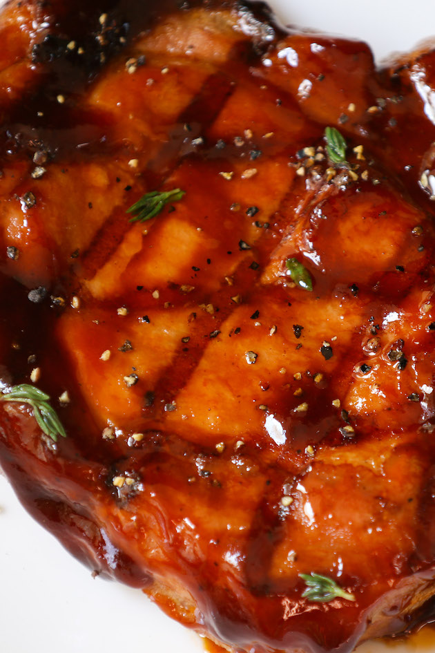 Pork chop grilled to perfection and served on a plate
