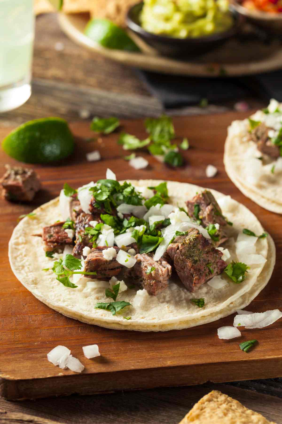 Marinated Skirt Steak Tacos are tender, juicy and flavorful. Also known as Carne Asada Tacos, this mouthwatering Mexican dish will have you going back for seconds. By combining the marinated skirt steak with delicious toppings, these tacos are always a winner.