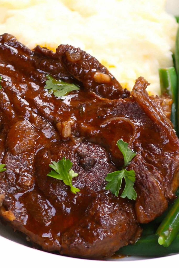 These are the MOST tender lamb shoulder chops you will ever have! Braising is the BEST way to cook this tough cut! Cooked low and slow in the rich red wine sauce, these braised lamb shoulder chops are fall-off-the-bone tender, rivaling the prime cuts at a fine dining restaurant! No need to spend top dollar on expensive cuts!