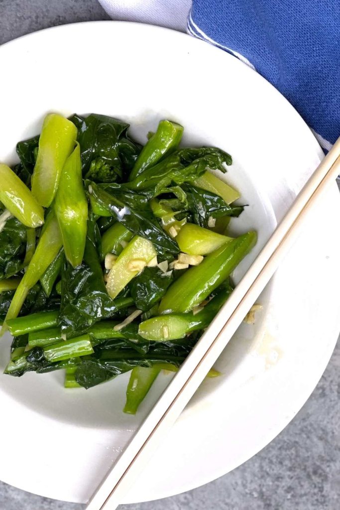 Serving Chinese broccoli on a plate
