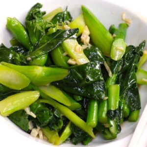 Chinese broccoli, or Gai lan, is a healthy and easy vegetable that cooks in minutes. The secret for the crisp texture is to blanch briefly before stir-frying. When making this recipe, be careful not to burn the garlic. You can use the sauce with other Asian greens such as bok choy or cabbage.