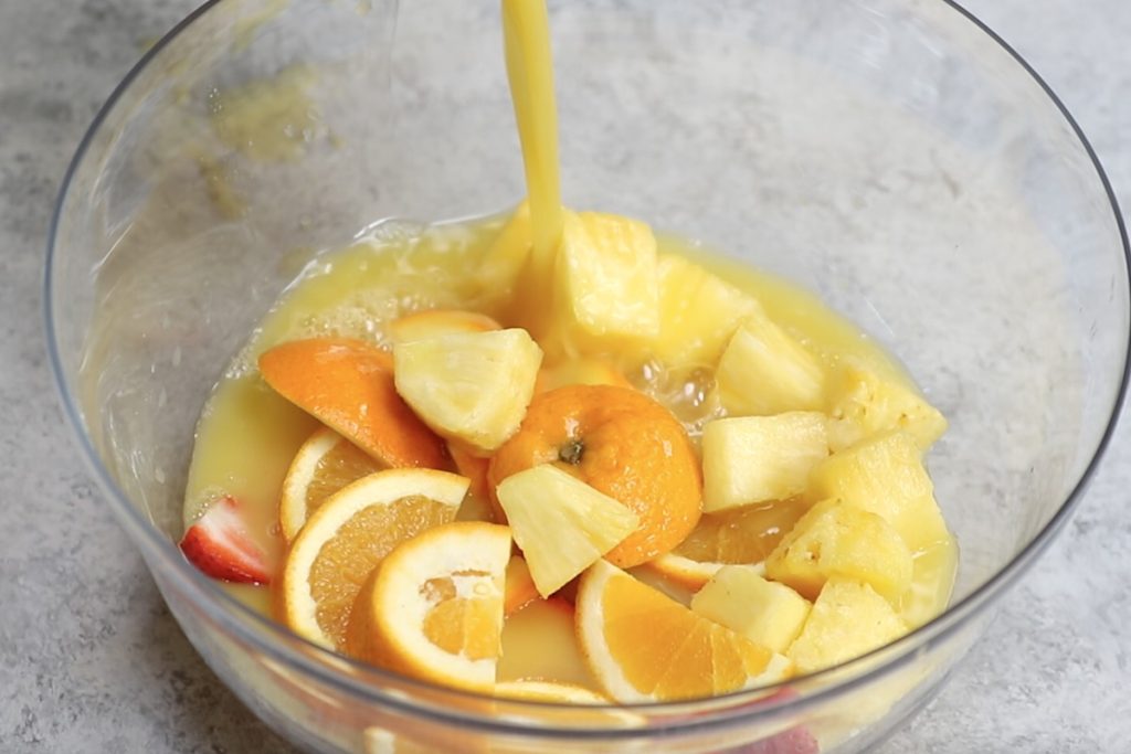 Combine fruits with juices and alcohol