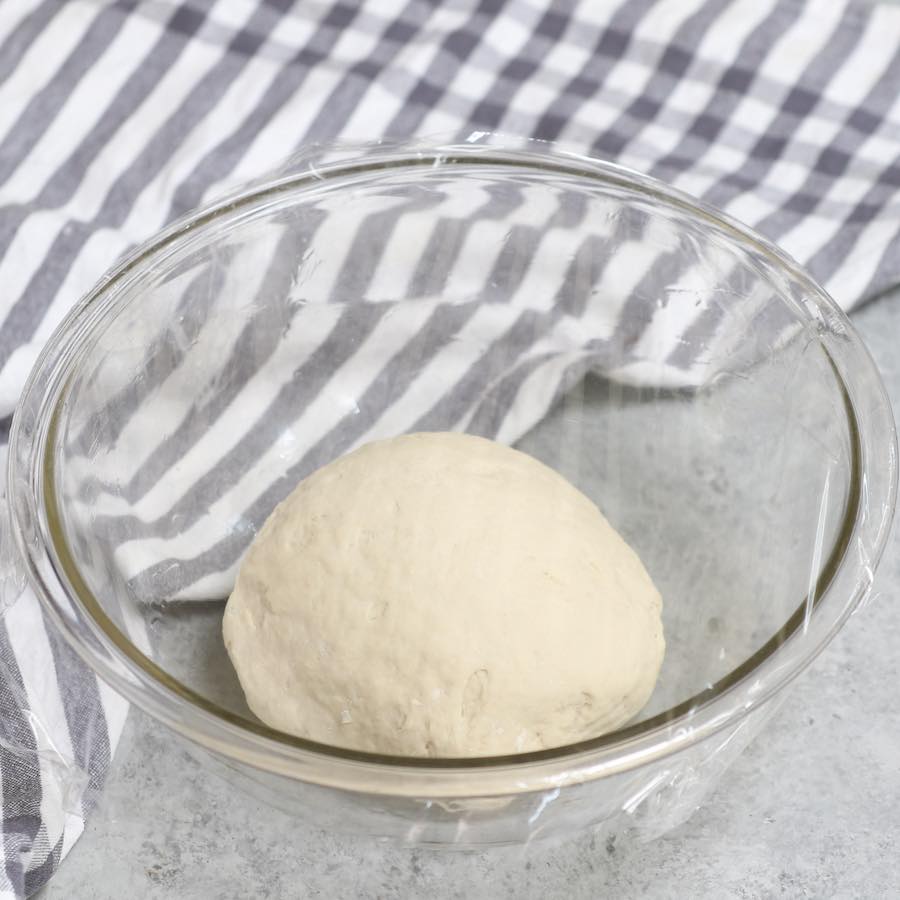 Place the dough in a bowl, and cover with plastic wrap