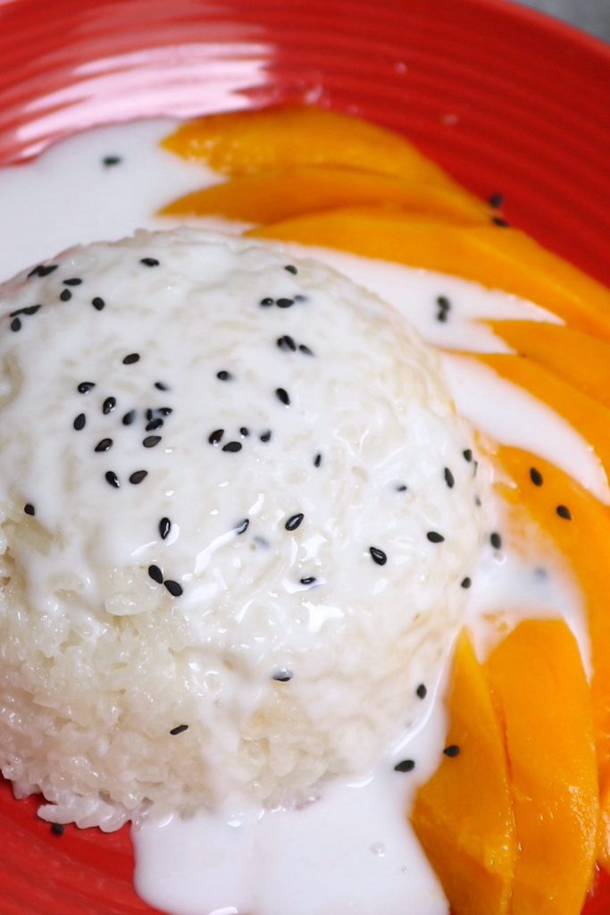 This is a much FASTER and EASIER version of everybody’s favorite mango sticky rice! The trick is to use a rice cooker rather than a stove. The sticky rice comes out perfectly sticky with a nice chewy texture, just like you get at Thai restaurants. Mix it with the sweet and slightly salty coconut sauce, and serve with mango for an incredible dessert. It’s ready in under an hour, no soaking required! Totally a game-changer!