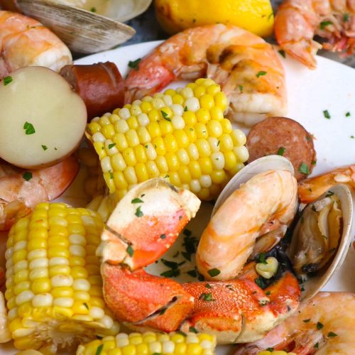 No false promise: this is a seriously impressive Seafood Boil that is made entirely in one LARGE pot in 30 minutes! This Southern crowd-pleaser includes crabs, clams, shrimp, sausages, potatoes, and sweet corn, all boiled together in a flavorful Cajun broth! Serve it with a popular Seafood Boil Sauce for the most satisfying meal!