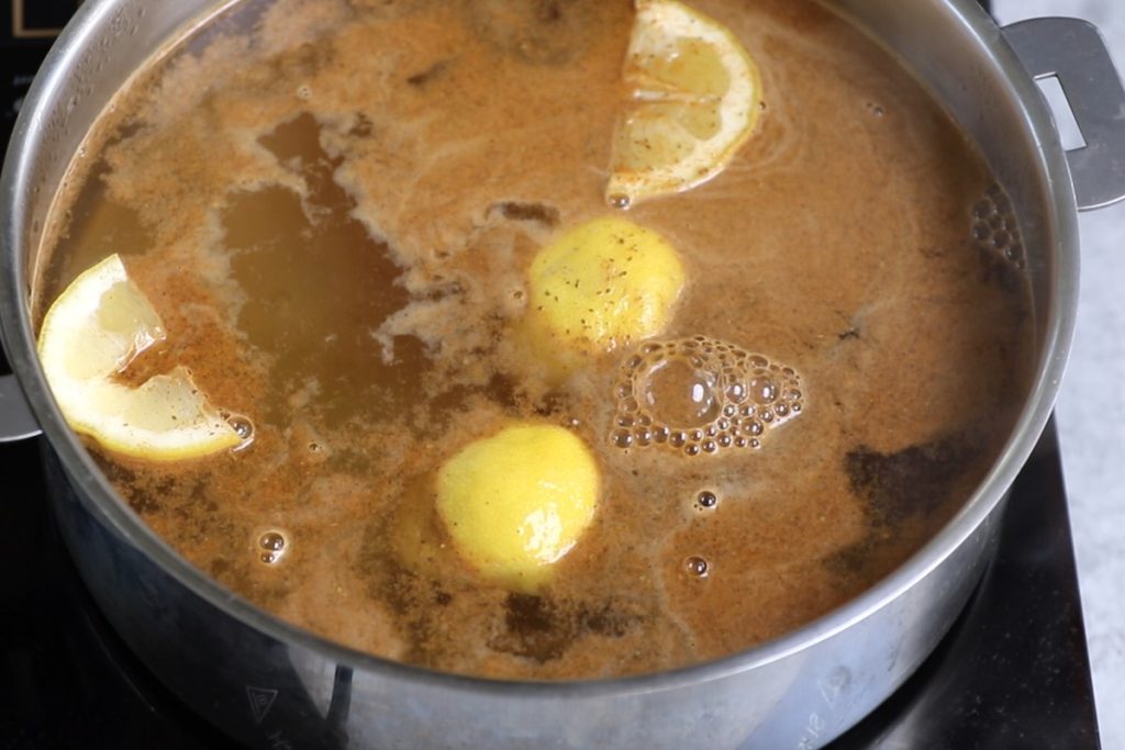 Add old bay seasoning, lemon and garlic to the water