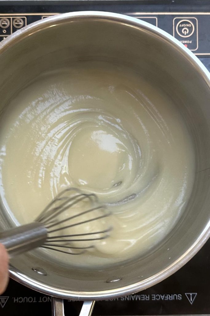 The roux is thick enough and you can see streaks formed by the whisk