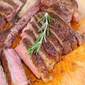 This oven baked T-bone steak has a caramelized crust on the exterior, and is tender and juicy in the middle. Ready in less than 15 minutes, it is a quick and easy family favorite! After making this recipe for more time than I can count, I have for you a foolproof method to guarantee restaurant quality every time!