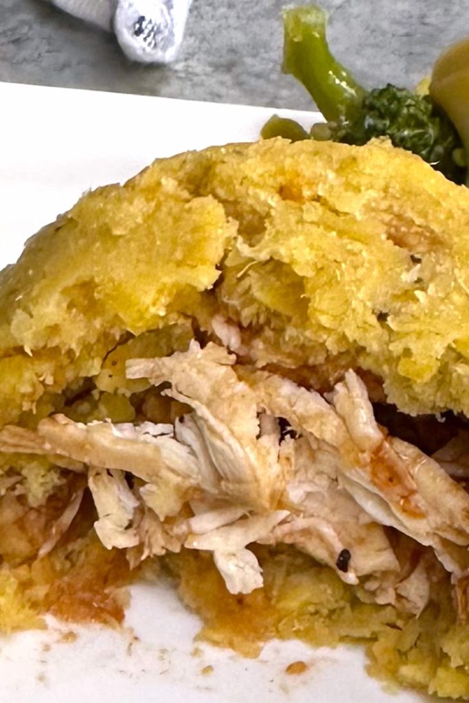 Seasoned with garlic and oil, then mixed with crispy pork cracklings, this Puerto Rican chicken stuffed mofongo is made with fried green plantains. It’s smooth, soft, and creamy. Serve it fresh and hot as a delicious side dish or main with your favorite sauce.