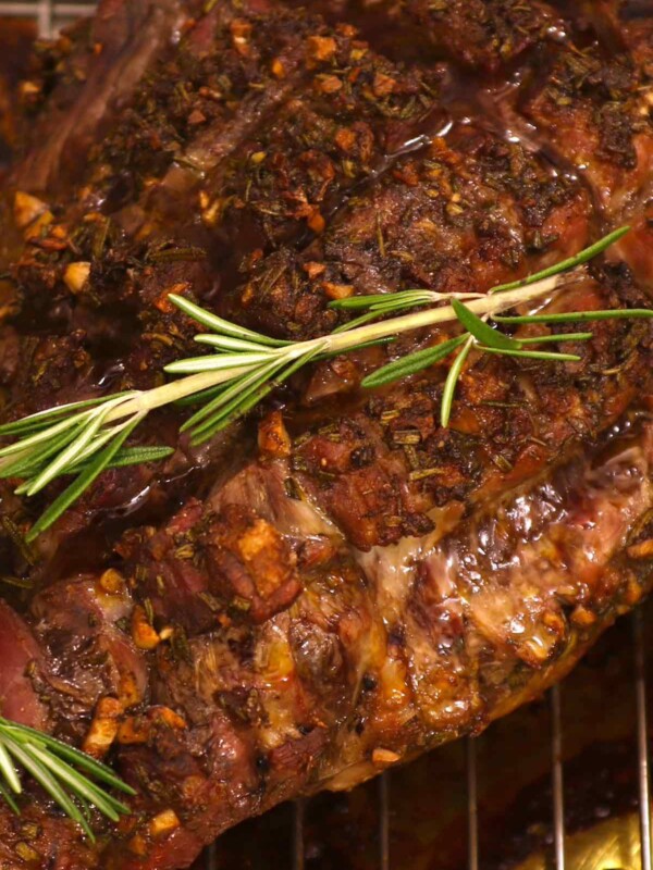 This juicy and EASY Roasted Leg of Lamb recipe features an herb and garlic seasoning on a bone-in or boneless leg of lamb. This no-fail method will give you the perfect and delicious result every time – perfect for special occasions or holiday dinners.