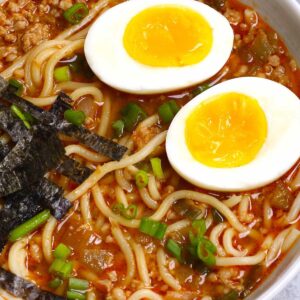 Japanese recipes &ndash; spicy miso ramen bowl with soft-boiled eggs, noodles, nori strips, and green onions